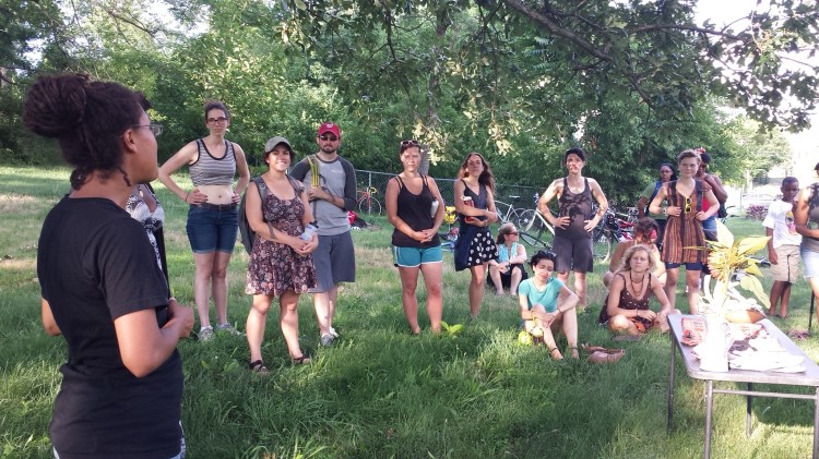 Gail Taylor of Three Part Harmony Farm speaking to the bike riders. 